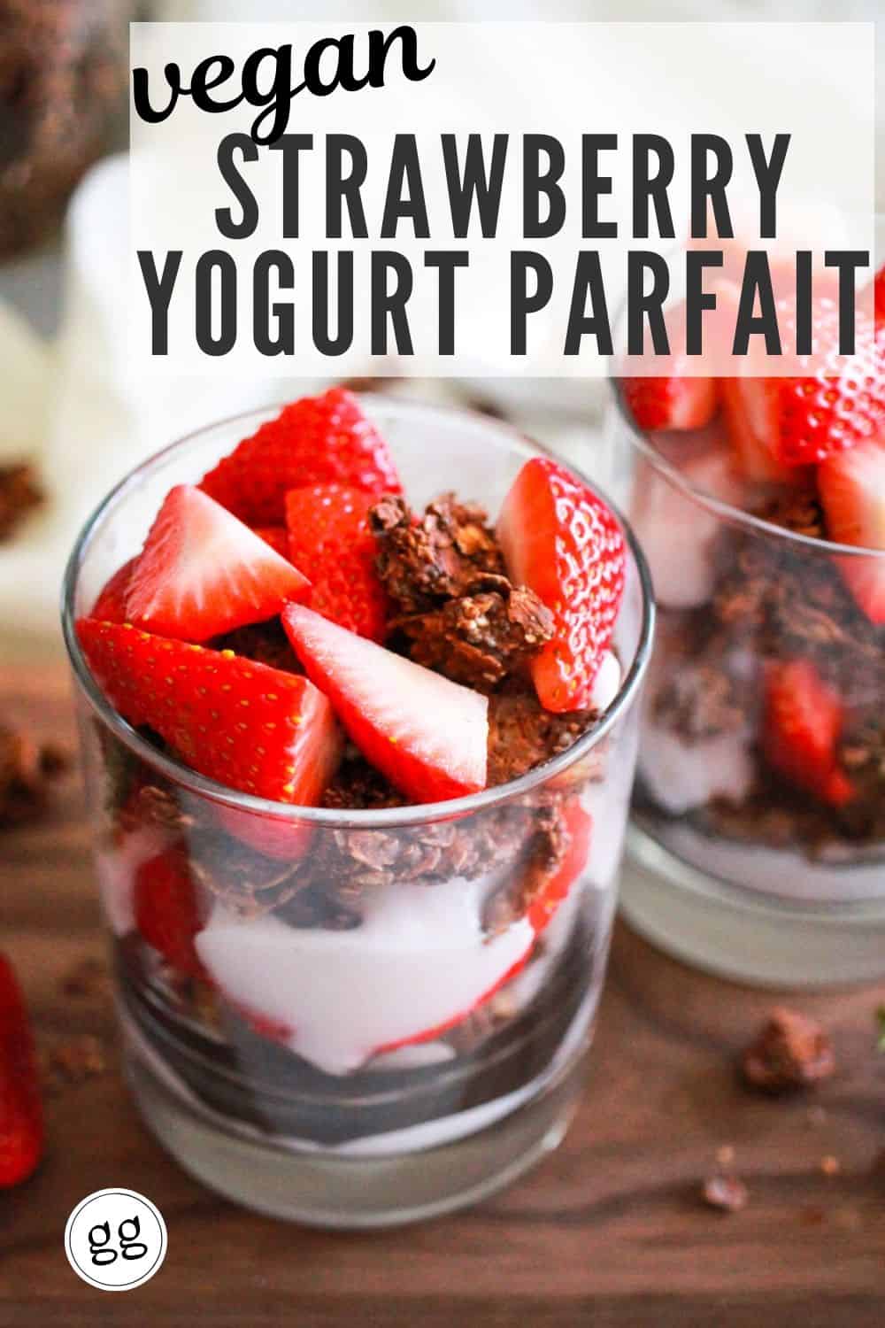 Yogurt parfait in a glass with text that reads, "Vegan Strawberry Yogurt Parfait."