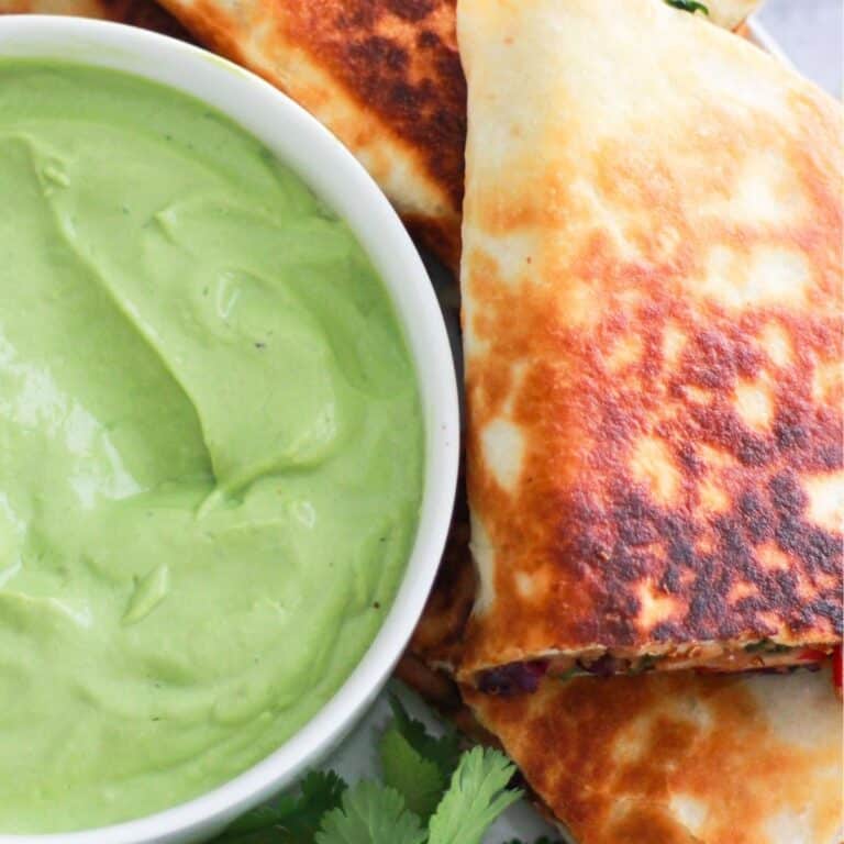 Vegetarian quesadilla served with avocado dipping sauce.