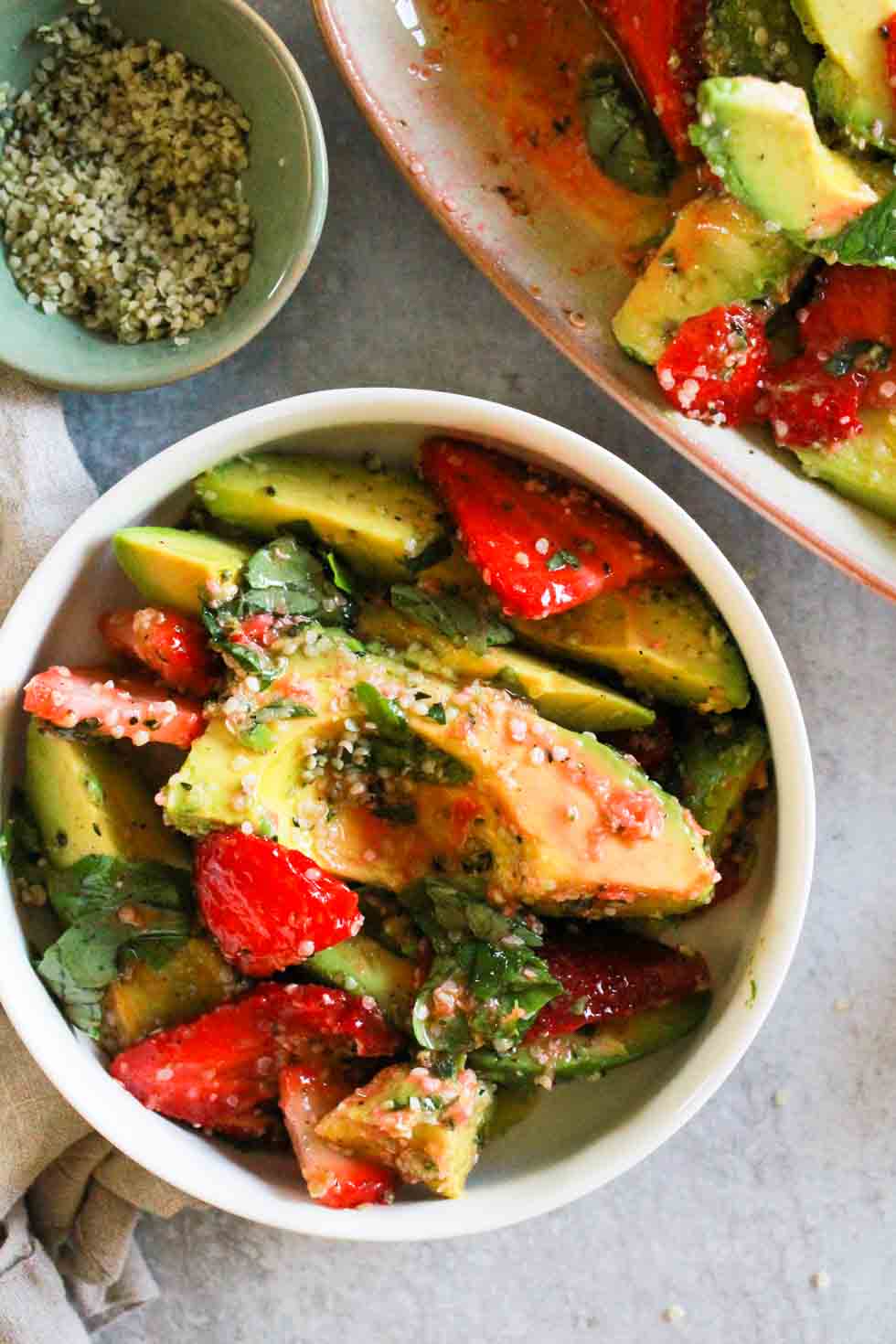 Strawberry Hemp Avocado Salad in a white bowl.