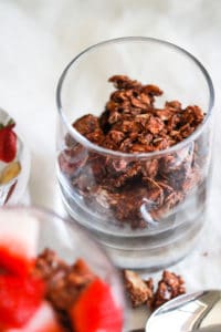 Chocolate chia seed granola in a glass.