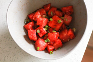 Bowl of marinated watermelon cubes.
