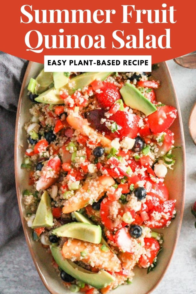Summer quinoa salad with fruit and avocado on tan serving dish with red and white text that reads, "Summer Fruit Quinoa Salad: easy, plant-based recipe"