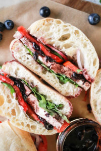 Halved tomato basil sandwich with blueberry sauce as an easy college meal