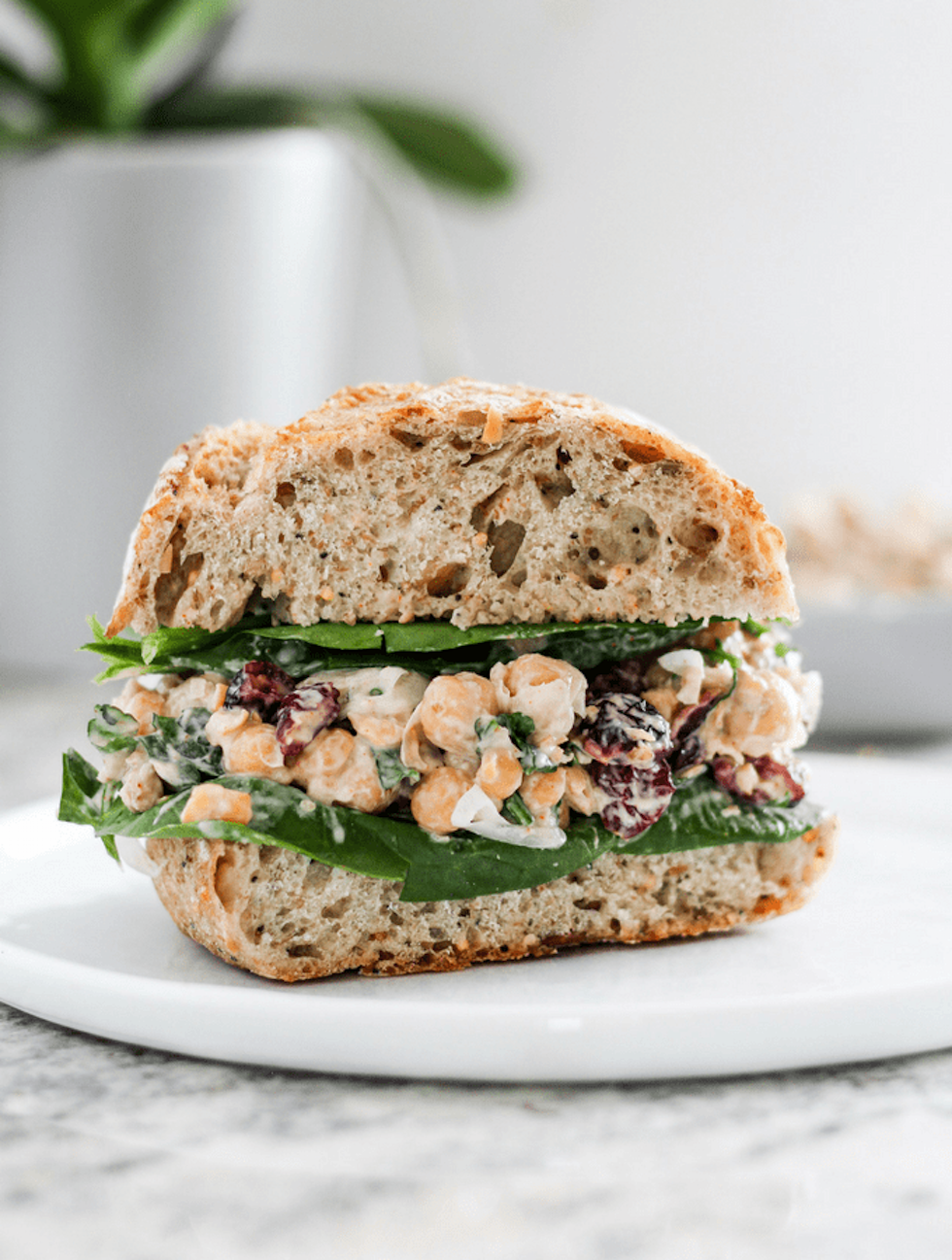 Chickpea salad sandwiches on a white plate as an example of easy college meals 