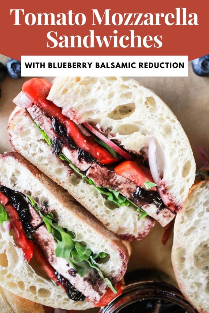 Vegetarian sandwich on ciabatta rolls with red and white text that reads, "Tomato Mozzarella Sandwiches with Blueberry Balsamic Reduction."