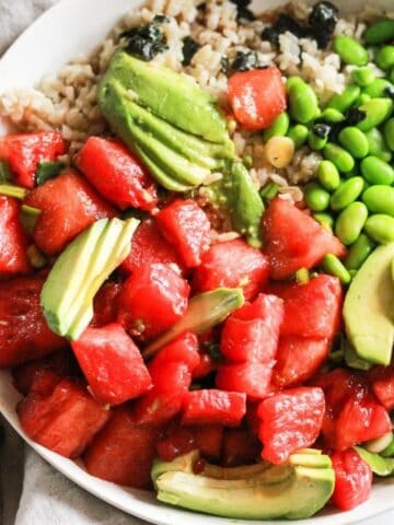 Vegan watermelon poke bowl with edamame, rice, and avocado.