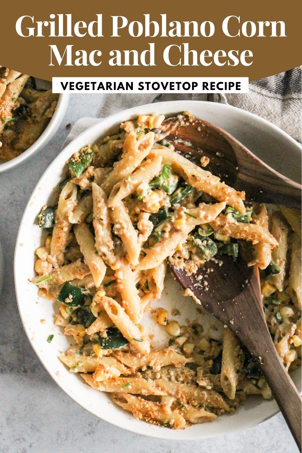 Cheesy pasta with grilled vegetables in a white bowl with brown and white text that reads, "Grilled Poblano Corn Mac and Cheese: Vegetarian Stovetop Recipe."