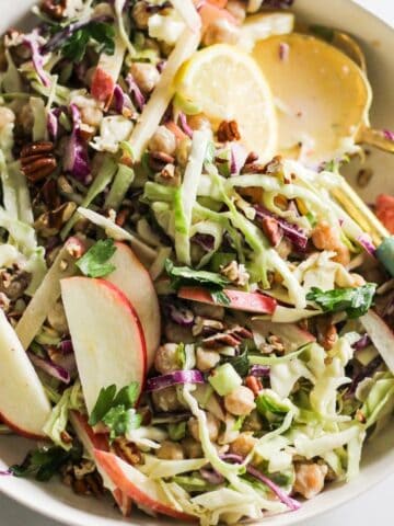 Vegetarian slaw with apples, chickpeas, and tahini dressing.