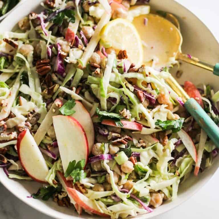 Vegetarian slaw with apples, chickpeas, and tahini dressing.