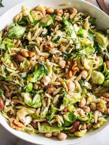 Mediterranean orzo pasta with Brussels sprouts, chickpeas, and olives.