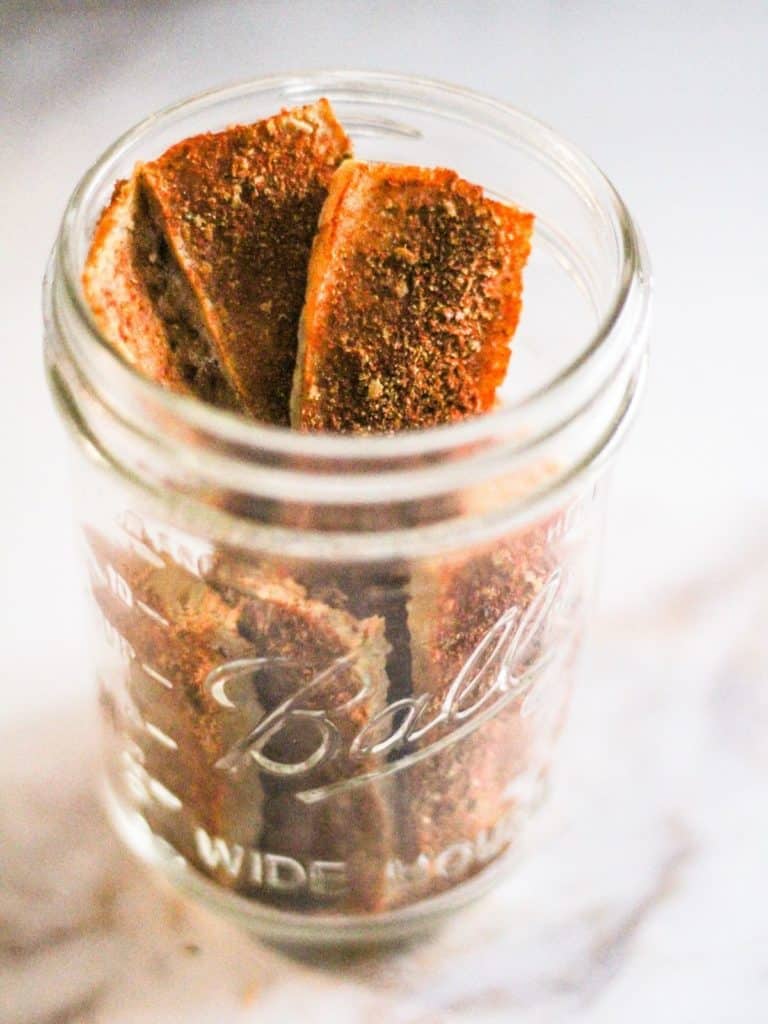 Tofu jerky in a glass jar.