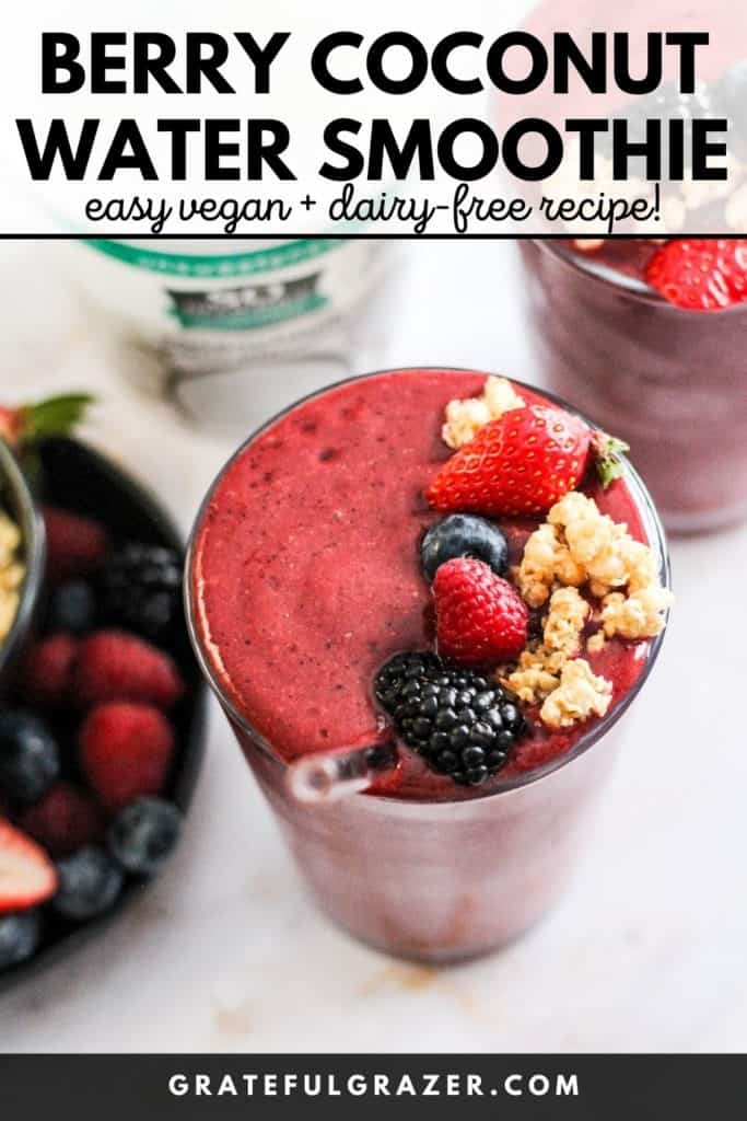 Berry smoothie in a glass topped with fresh berries and granola with text, "Berry Coconut Water Smoothie: easy vegan and dairy-free recipe!"