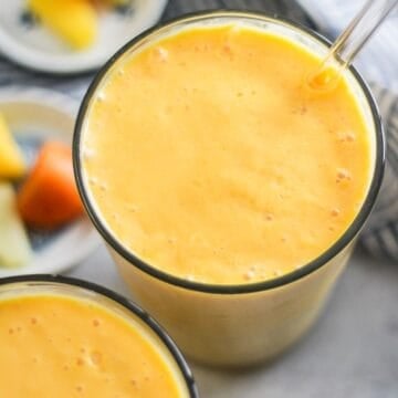 Creamy papaya smoothie with mango and pineapple.