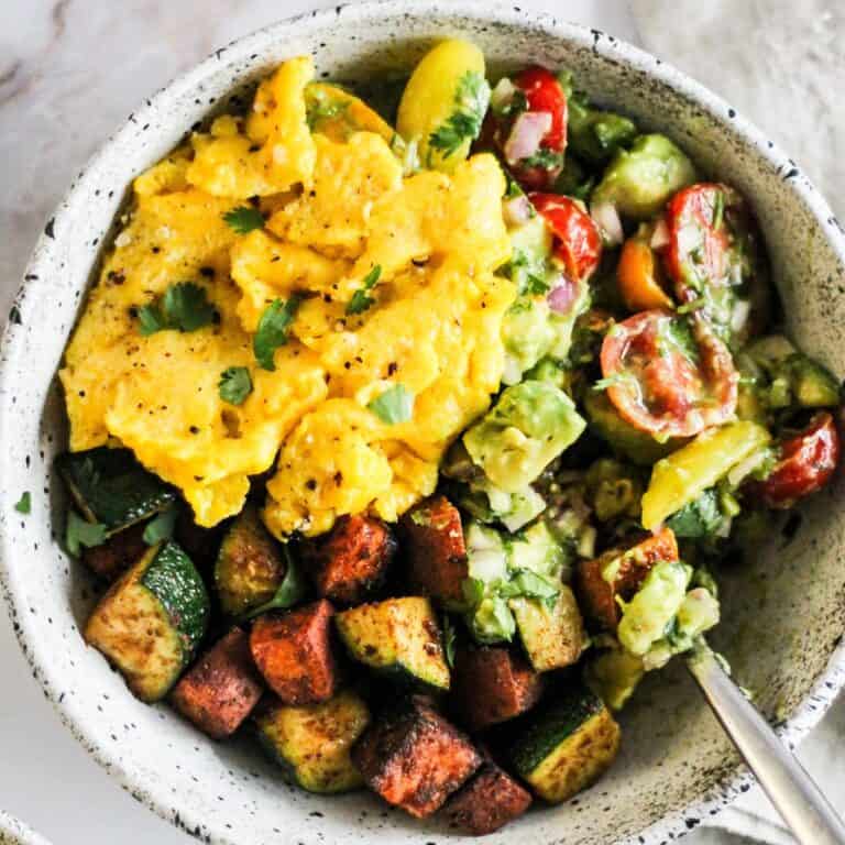 Sweet potato breakfast bowl with eggs and avocado.