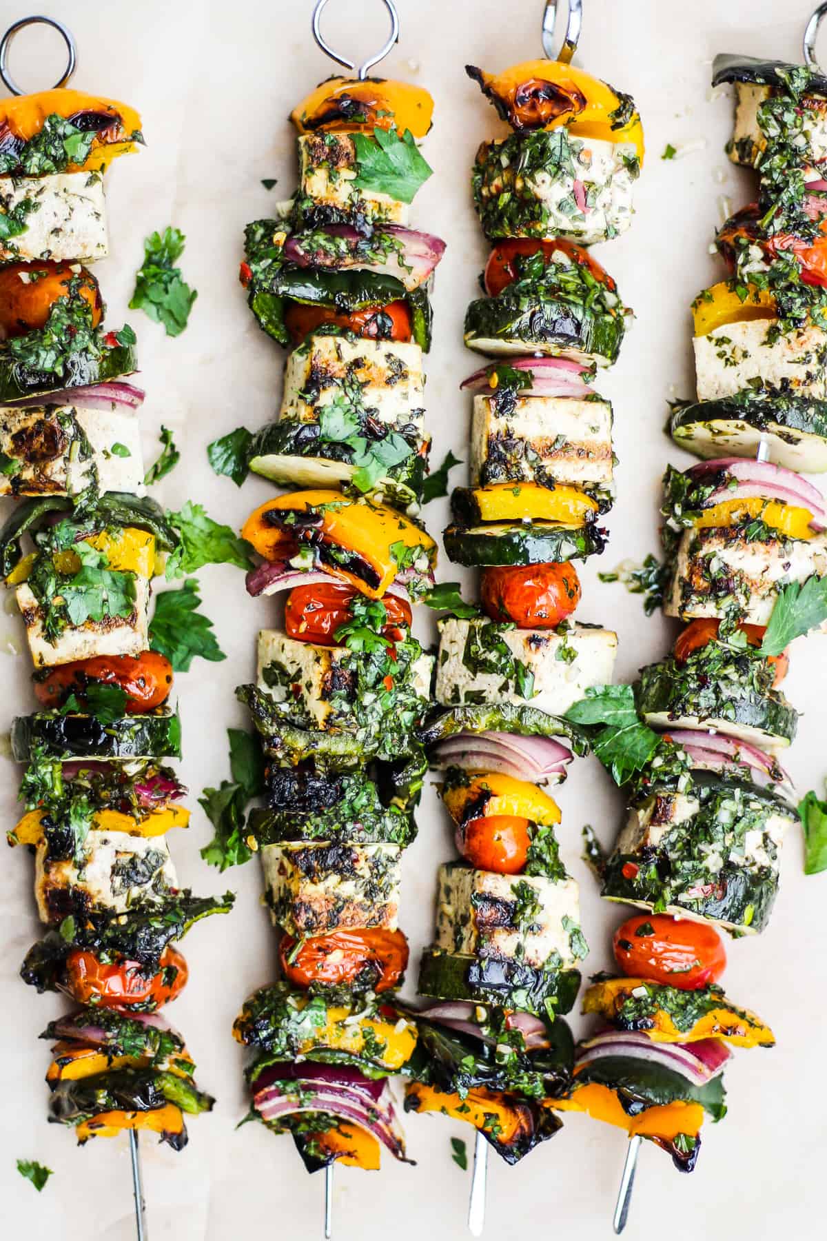 Chimichurri Grilled Tofu Skewers on parchment paper.