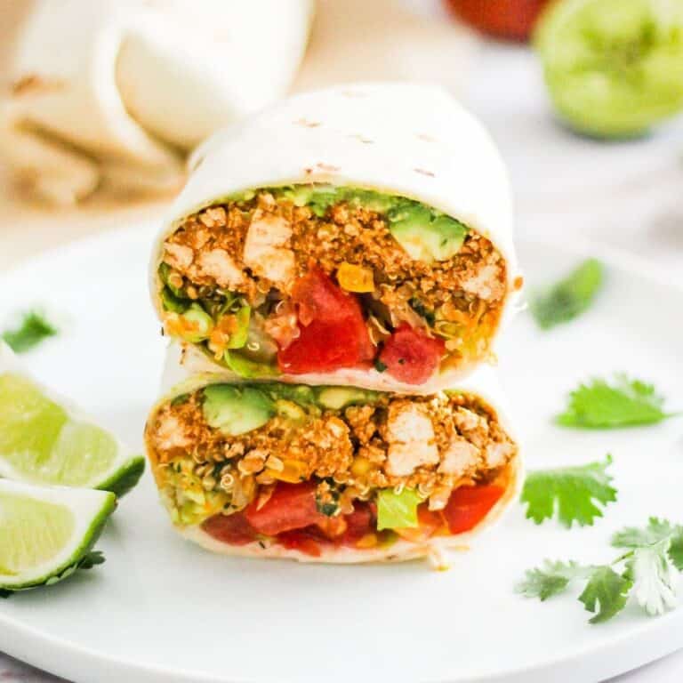 Vegetarian Sofritas tofu burrito with avocado and tomato.