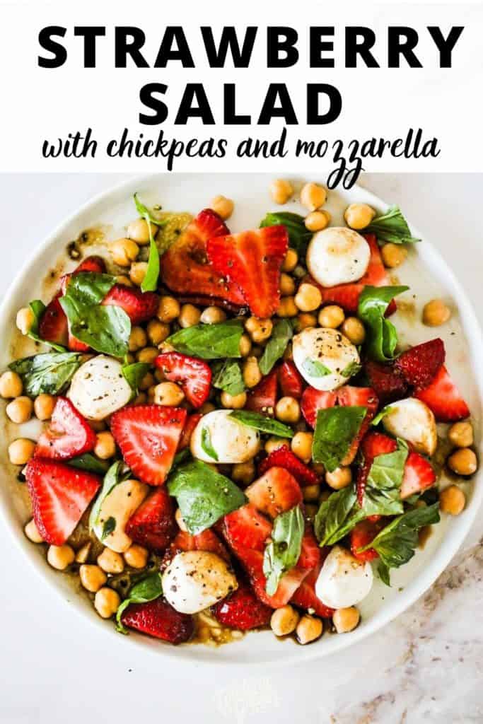 Strawberry Salad on a white plate with text reading, "strawberry salad with chickpeas and mozzarella."