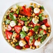Strawberry chickpea salad with mozzarella and fresh basil for summer.