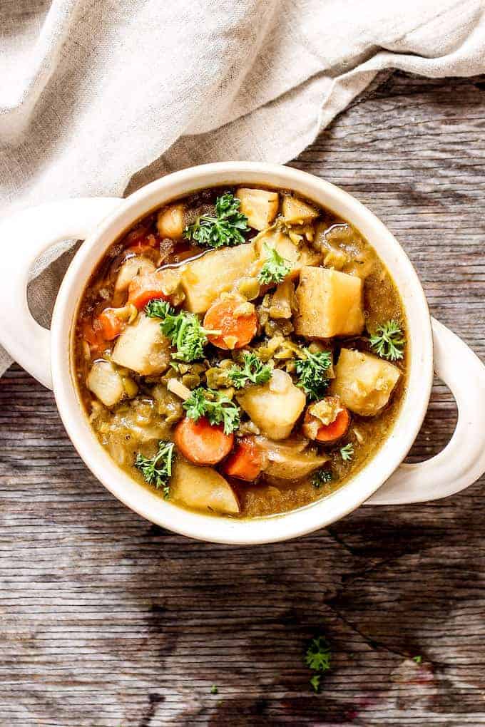 Vegan Irish Stout Stew in a white crock.