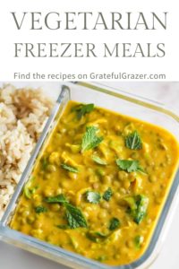 Squash curry in a meal prep container and text that reads, "Vegetarian Freezer Meals; Find the recipes on GratefulGrazer.com"