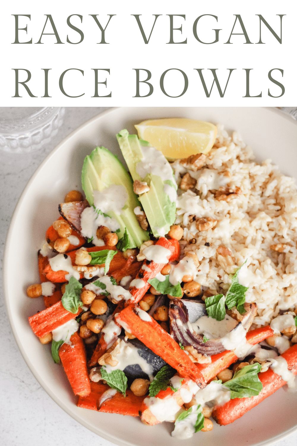 White bowl with chickpeas, roasted carrots, onion, avocado, and creamy lemon tahini sauce with text that reads, "Easy Vegan Rice Bowls."