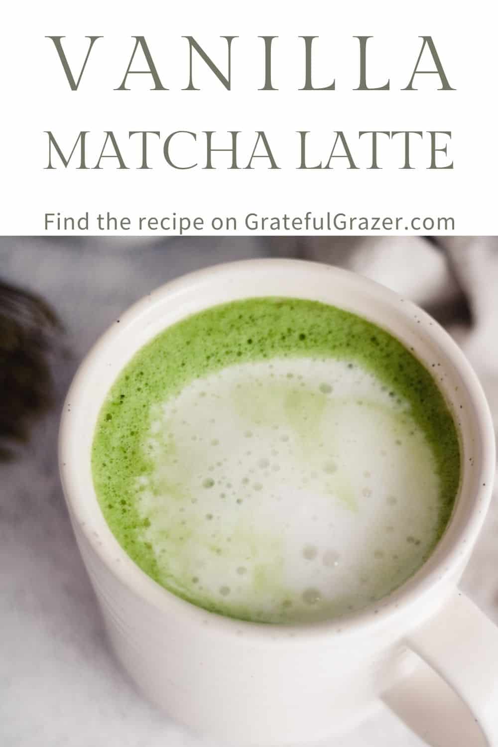 Oat Milk Matcha Latte in a white mug with text that reads, "Vanilla Matcha Latte; Find the recipe on GratefulGrazer.com." 