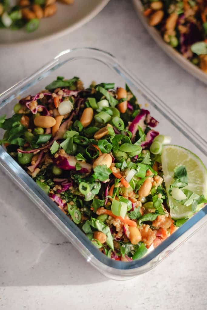 Edamame salad in a glass meal prep container.
