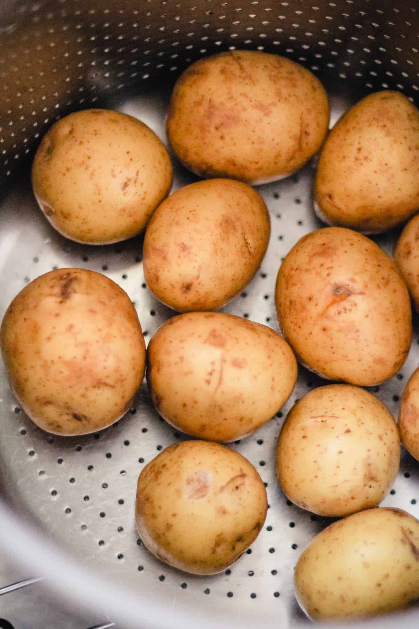 Baby gold potatoes in a strainer pot.