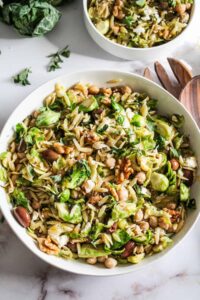 Orzo pasta salad with Brussels sprouts, chickpeas, and olives.