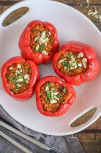 Red bell peppers stuffed with coconut curry.