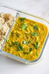 Butternut squash coconut curry in a meal prep container.