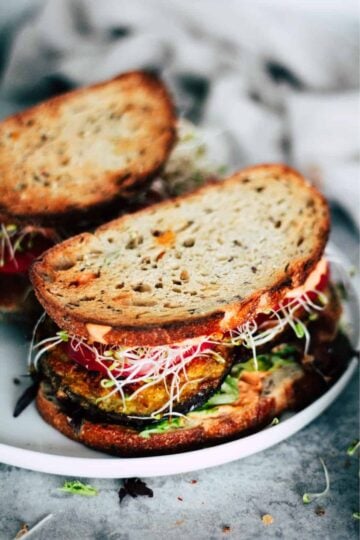 Fried eggplant sandwich with veggies and harissa mayo.