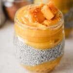Chia seed pudding in a jar with mango, banana, and coconut.