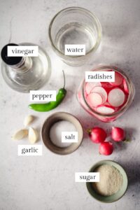 Ingredients for quick pickled radishes with labels.