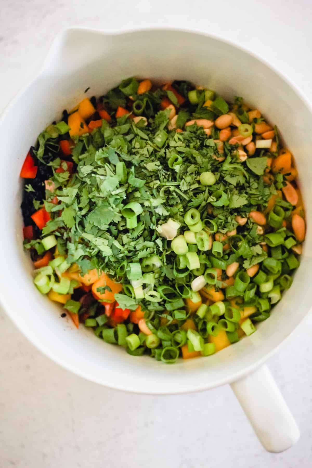 Black Rice Salad ingredients in a large mixing bowl.
