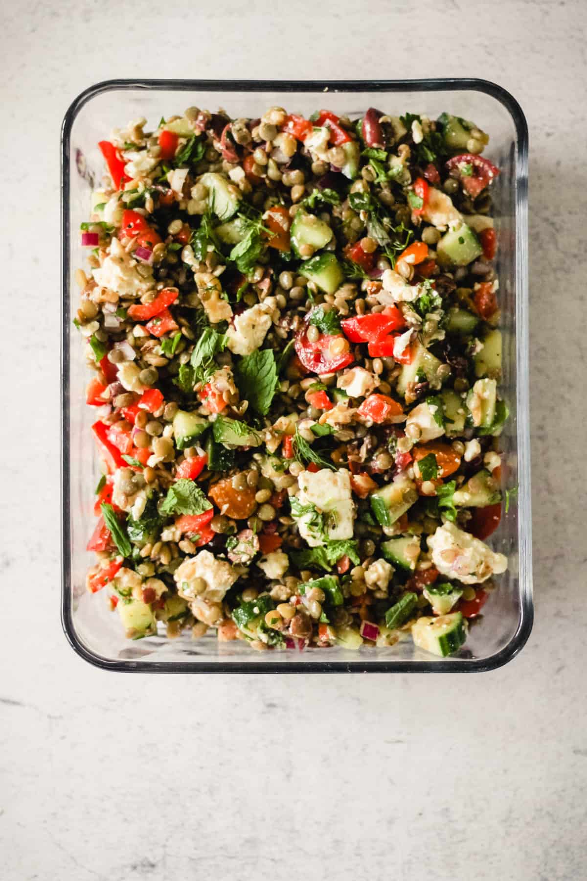 Lentil salad in a meal prep container.