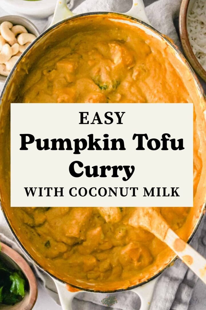 Pumpkin curry in a Dutch oven with text overlay reading, "Easy Pumpkin Tofu Curry with Coconut Milk."