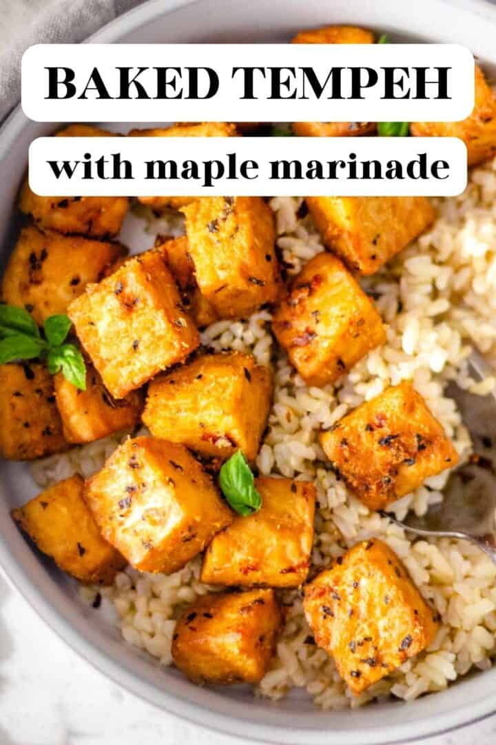 Baked tempeh cubes in a bowl with rice with text overlay that reads, "Baked Tempeh with Maple Marinade."