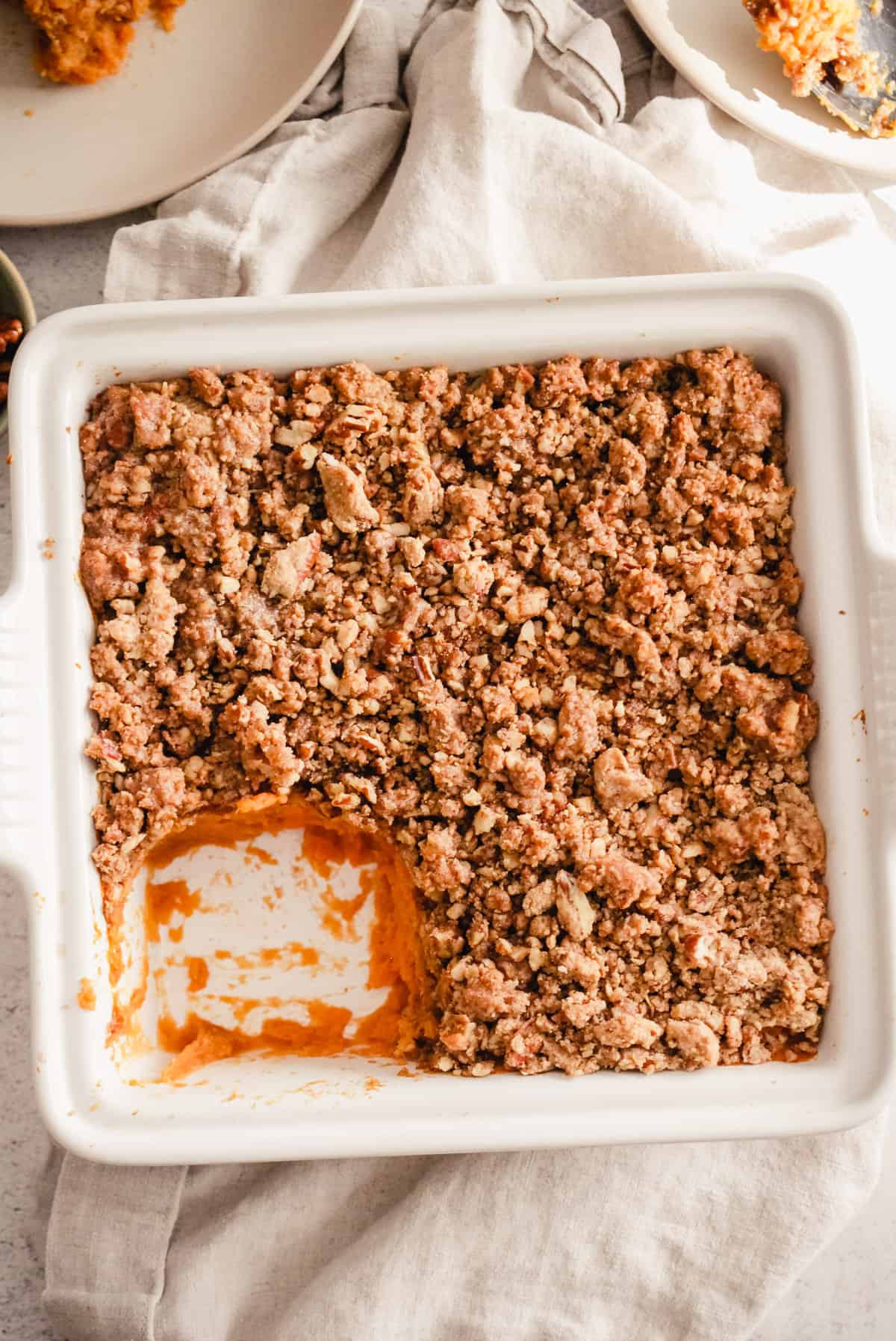 Overhead image of a sweet potato casserole in a square baking dish.
