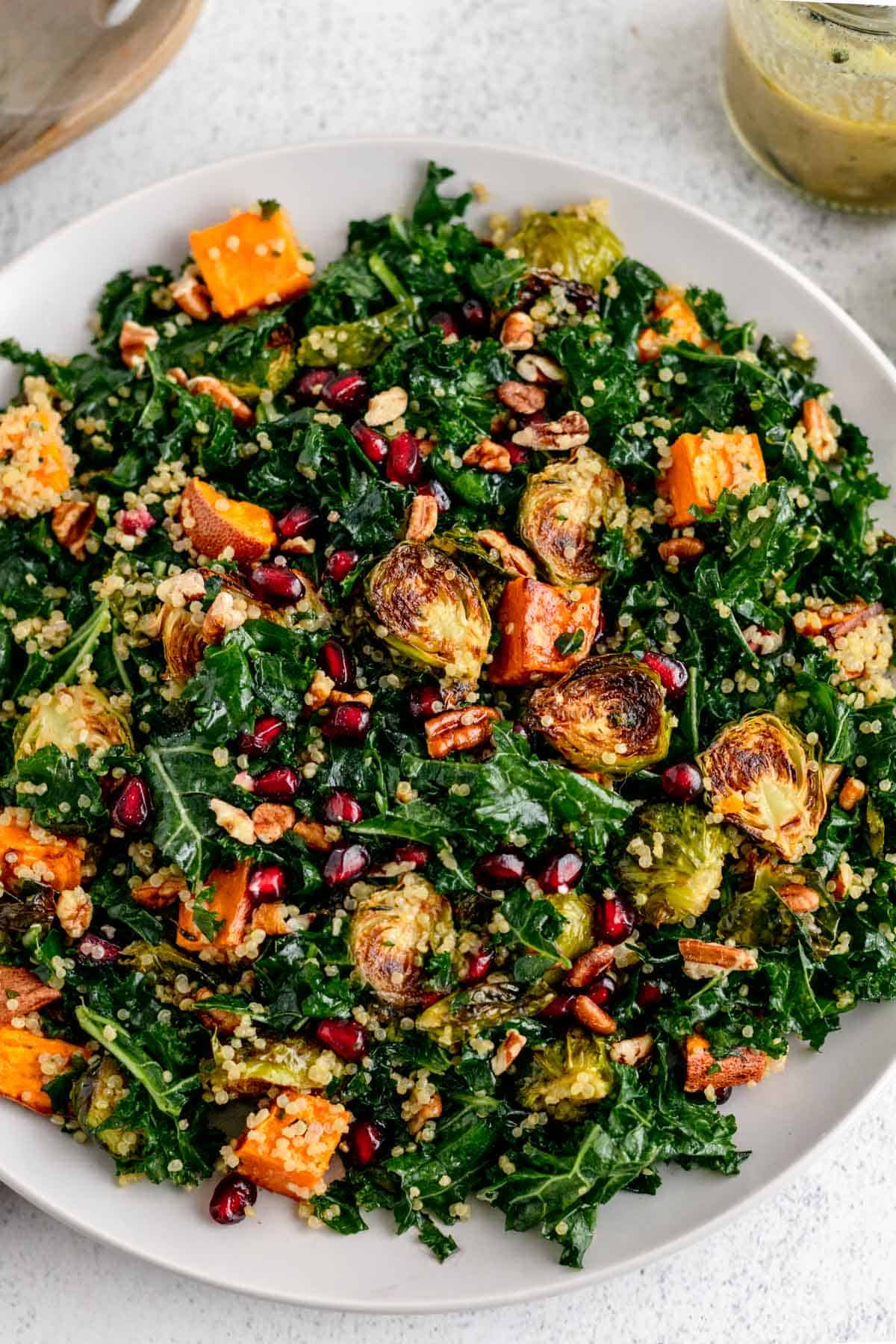 Closeup of Warm Roasted Vegetable Quinoa Salad with kale and pomegranate.