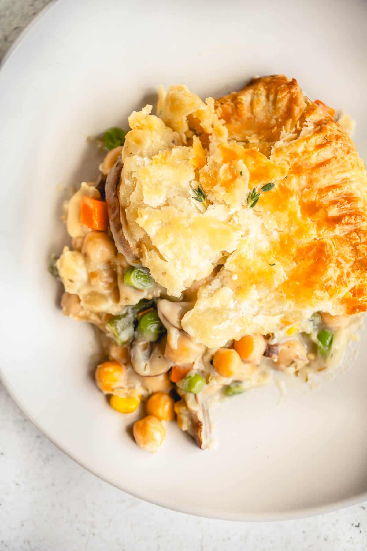 Portion of Vegetarian Vegetable Pot Pie with chickpeas on a plate.
