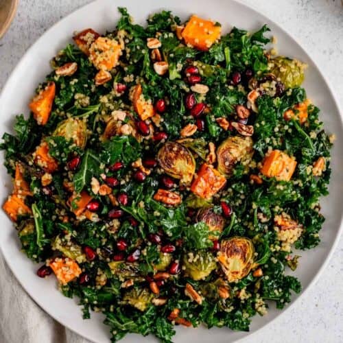 Roasted vegetable salad with sweet potato, Brussels sprouts, kale, and pomegranate.