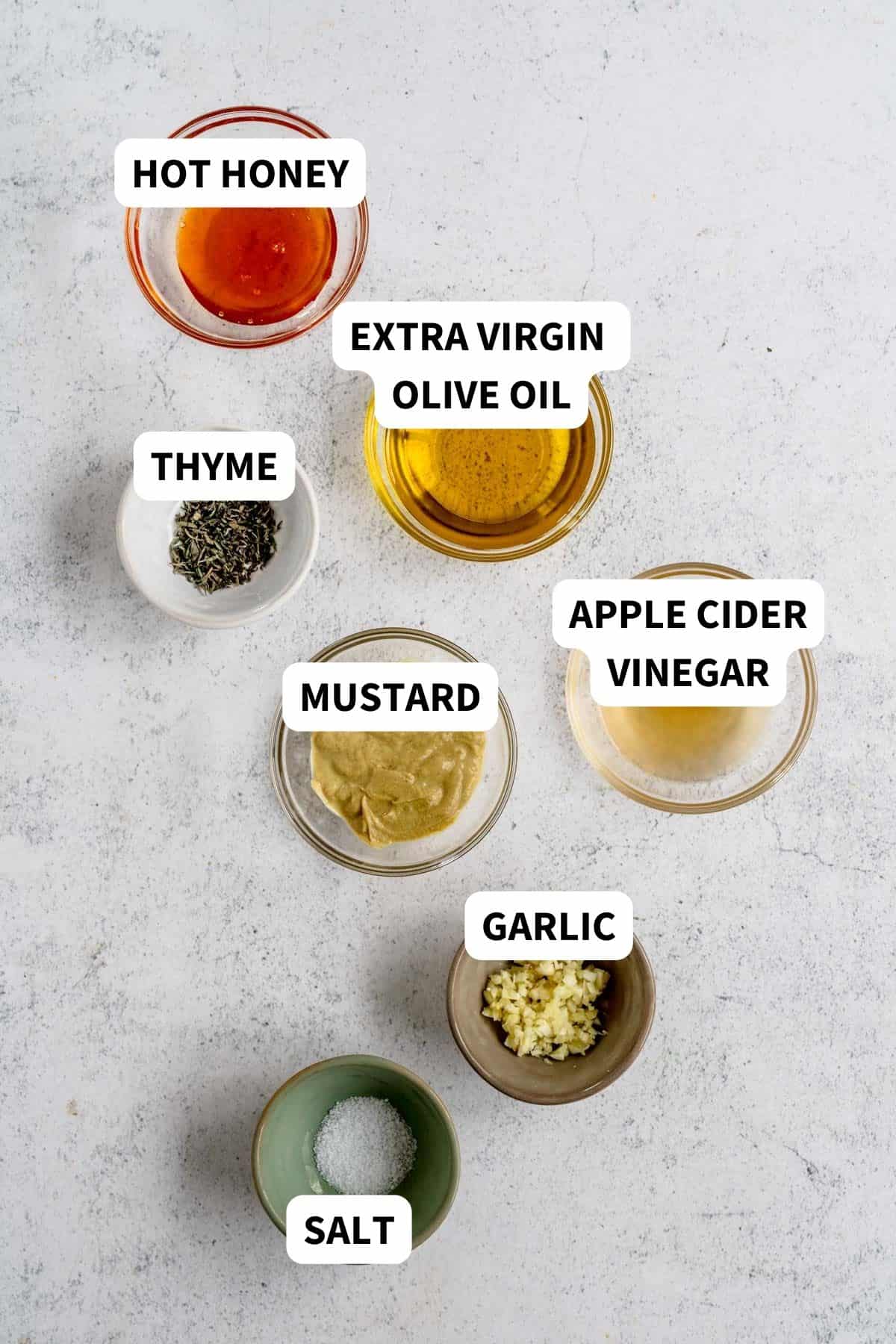 Labeled ingredients to make hot honey mustard salad dressing.