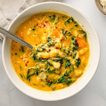Bowl of creamy Tuscan White Bean Soup with kale