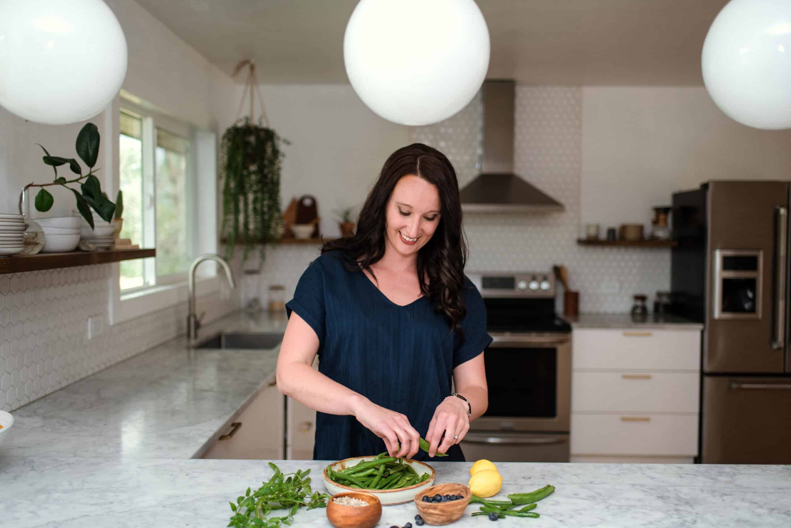 Dietitian preparing food in kitchen.
