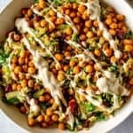 Brussels sprouts salad with roasted chickpeas ad tahini dressing.