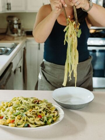 Serving pasta in the kitchen.