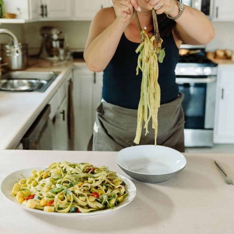 Serving pasta in the kitchen.