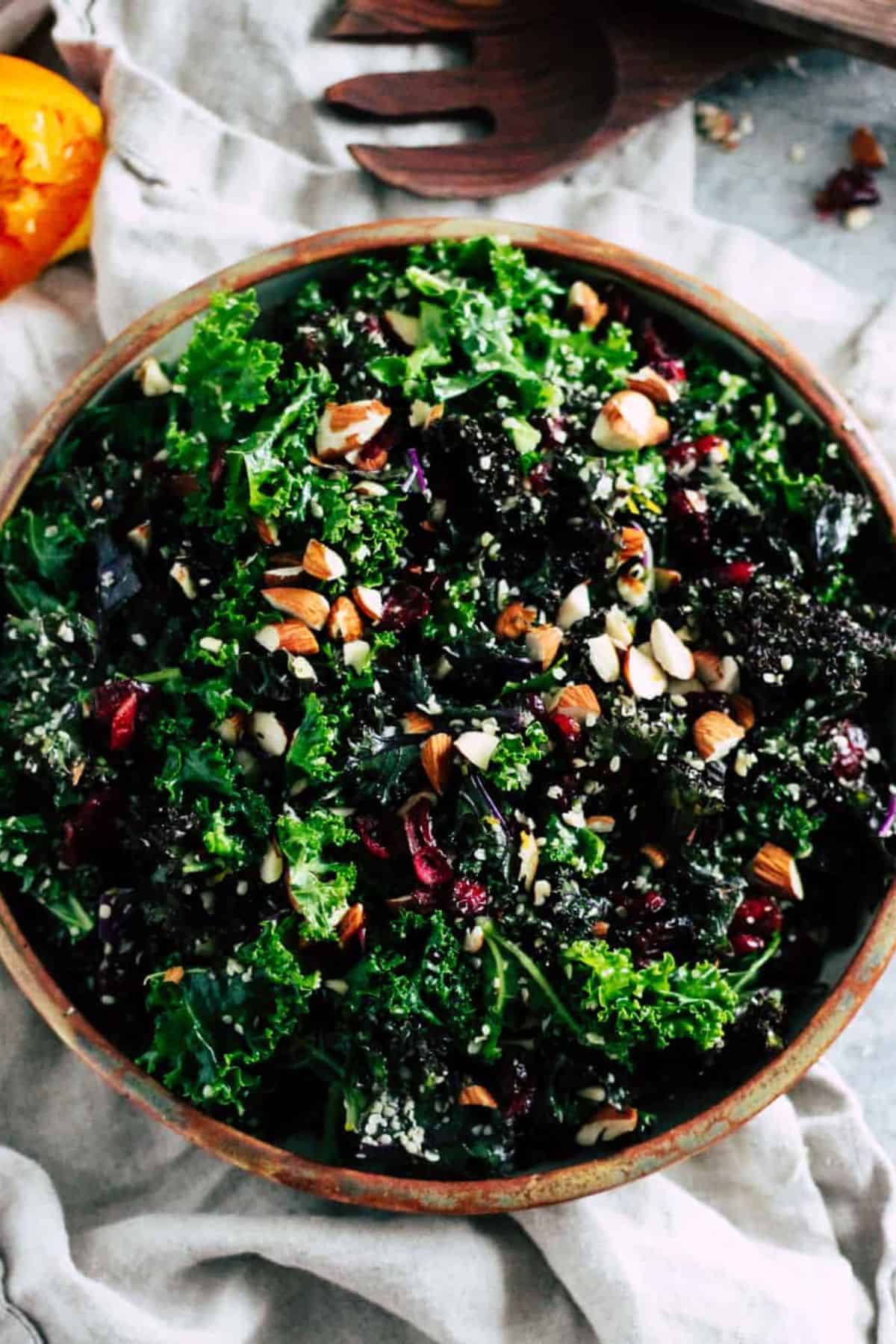 Festive holiday kale salad with cranberries and almonds.