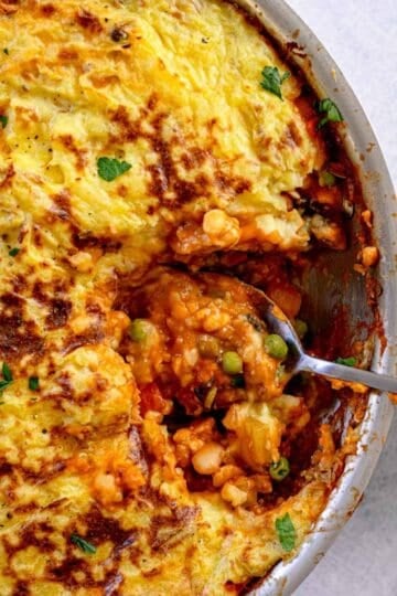 Vegetarian Thanksgiving main dish of shepherd's pie with beans, tempeh, and peas.